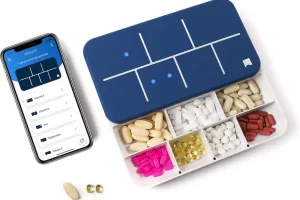 EllieGrid smart pill organizer with LED grid and app-compatible design